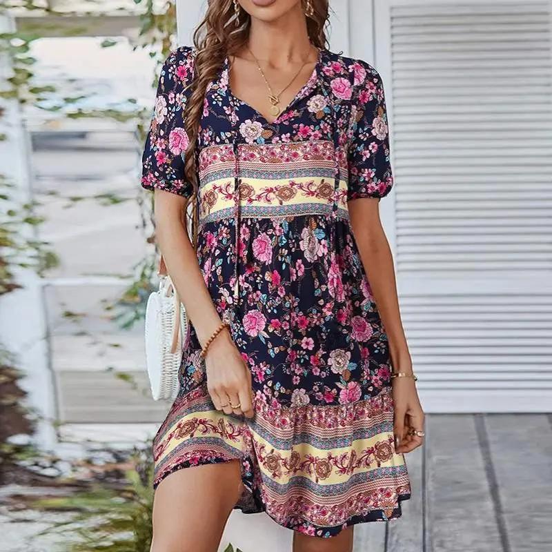 Women's midi dress featuring a V-neck design and a floral pattern, suitable for evening events and weddings. 1