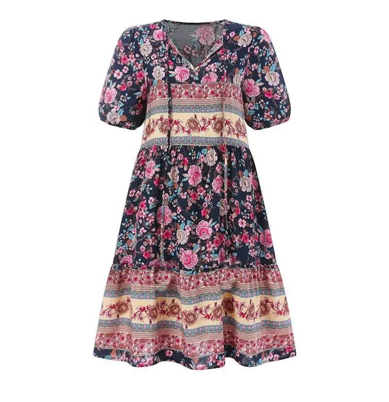 Women's midi dress featuring a V-neck design and a floral pattern, suitable for evening events and weddings. 2