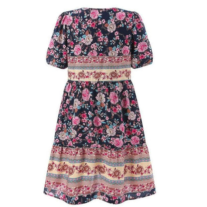 Women's midi dress featuring a V-neck design and a floral pattern, suitable for evening events and weddings. 3