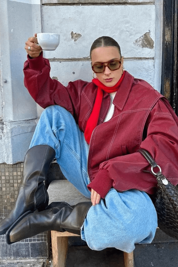 Women's oversized bomber jacket featuring contrast stitching details. 0