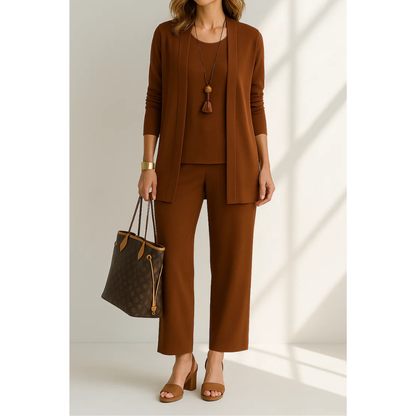 Three-piece women's casual set featuring a top, pants, and cardigan arranged neatly. The top has short sleeves, the pants are full-length, and the 0