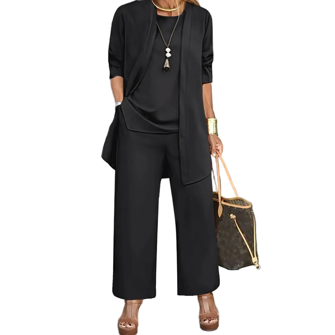 Three-piece women's casual set featuring a top, pants, and cardigan arranged neatly. The top has short sleeves, the pants are full-length, and the 1