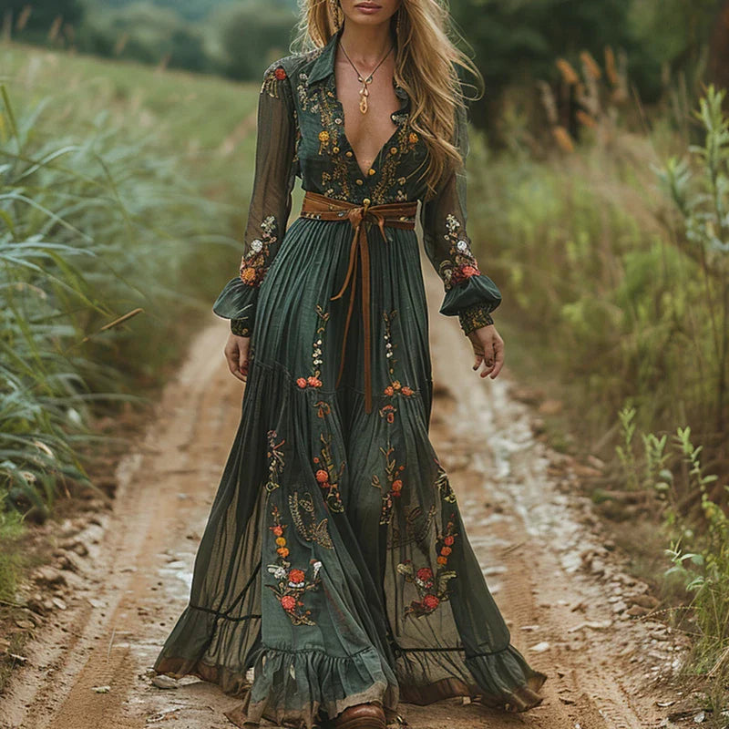 Maxi dress featuring a floral pattern and pleated silhouette, designed for formal occasions. 0