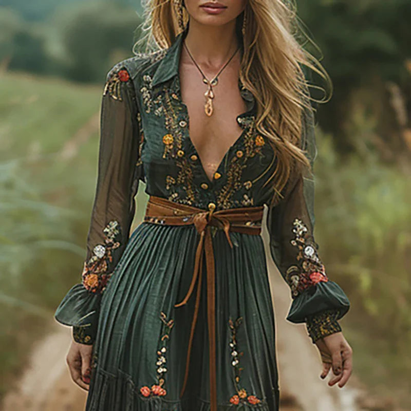 Maxi dress featuring a floral pattern and pleated silhouette, designed for formal occasions. 1