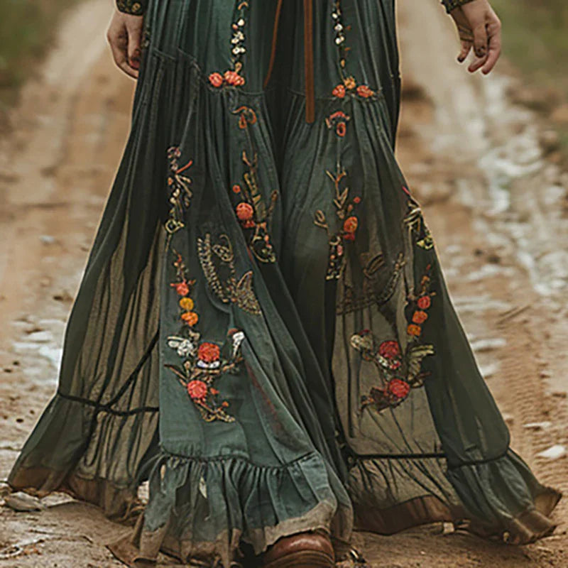 Maxi dress featuring a floral pattern and pleated silhouette, designed for formal occasions. 2