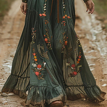 Maxi dress featuring a floral pattern and pleated silhouette, designed for formal occasions. 2